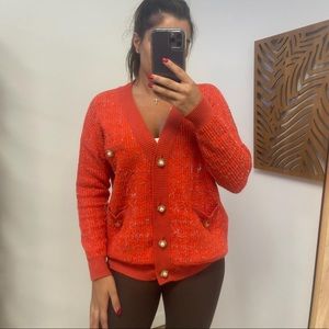 Red button up sweater